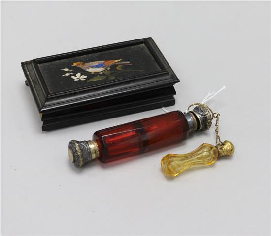 A Victorian glass scent bottle, and a smaller amber glass scent bottle and a small 19th Century rectangular pietra dure panel of a bird